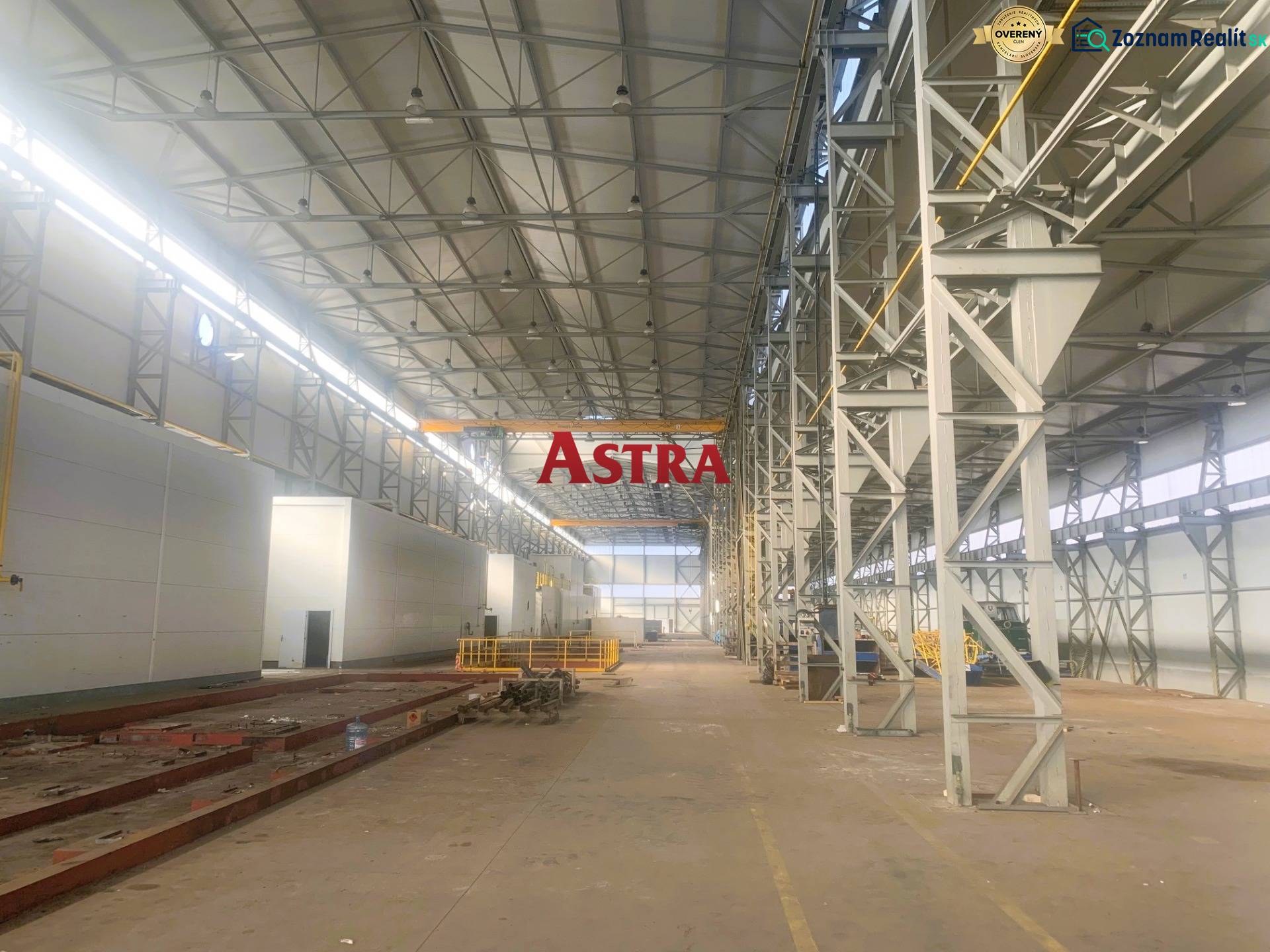 Large manufacturing spaces with high ceilings and steel structures.