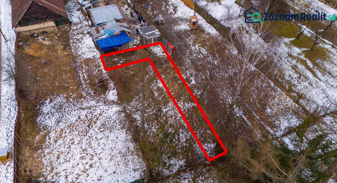 Aerial view of a snow-covered garden in Nálepkovo with a marked plot.