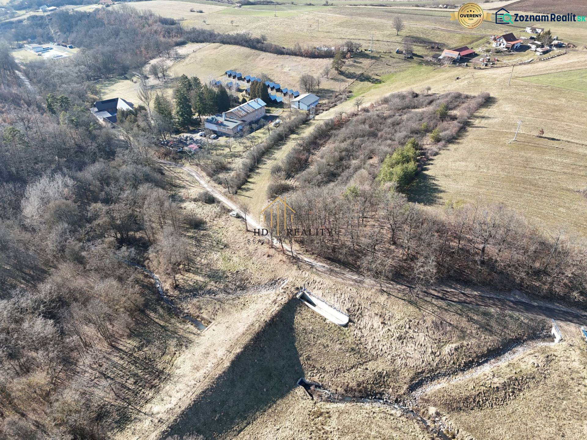 Aerial view of residential plots around Krupina with natural scenery.