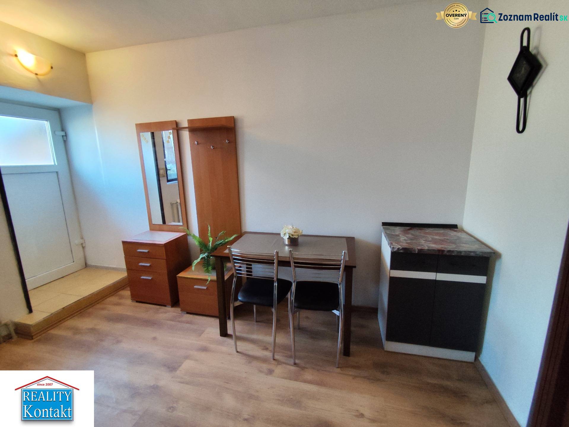 Interior of a 1-bedroom apartment with furniture and flooring featuring a wood decor.