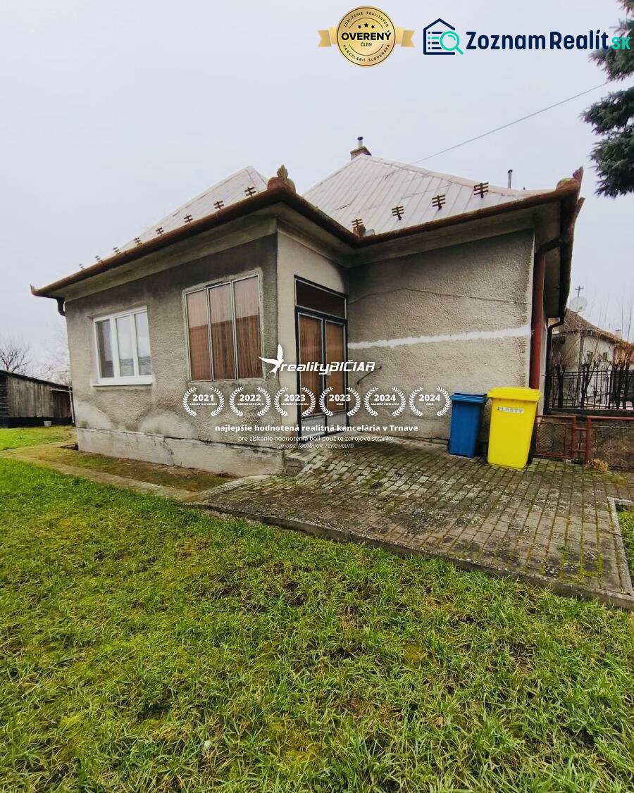 A family house on Seredska Street in Hlohovec with a small garden and a paved access area.