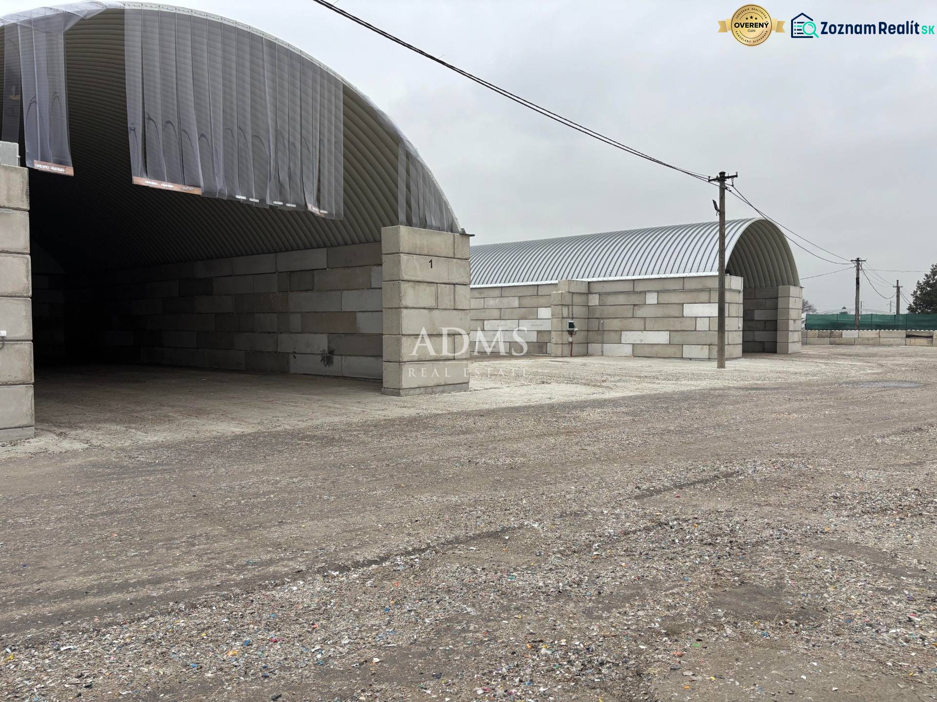 Warehouses and halls in the town of Ladce with arched roofs and concrete walls.