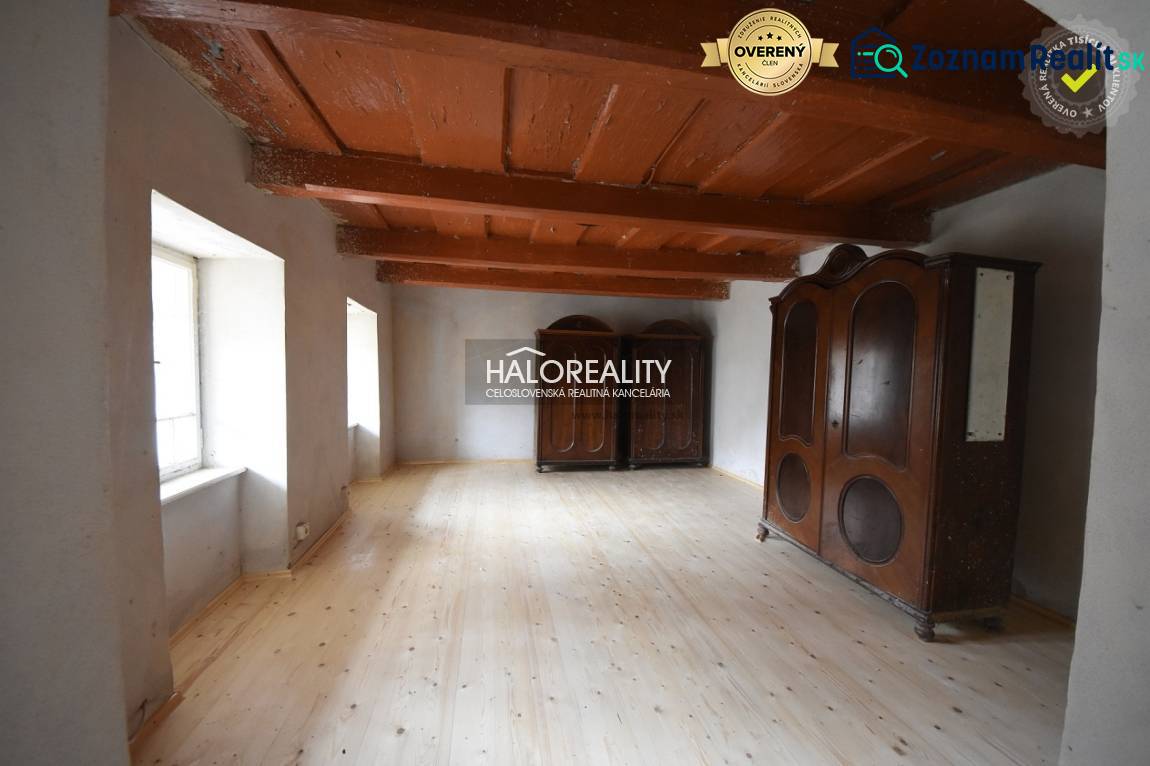 Wooden ceiling, floor with wooden decor, and massive cabinets in the cabin.