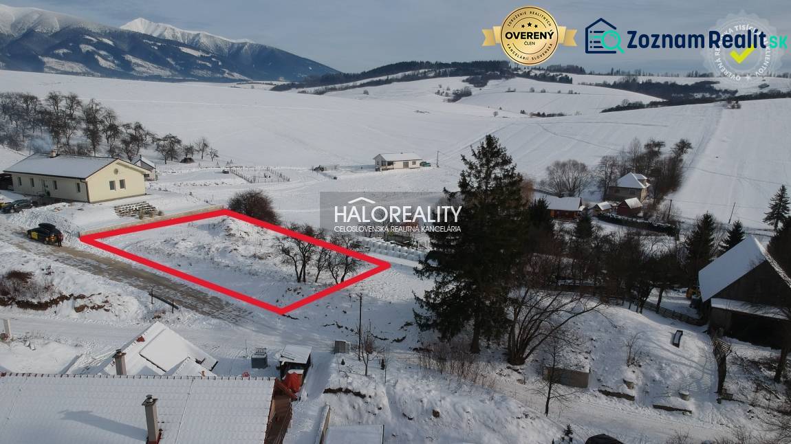Snow-covered residential lands in Liptovské Beharovce with a beautiful mountain view.