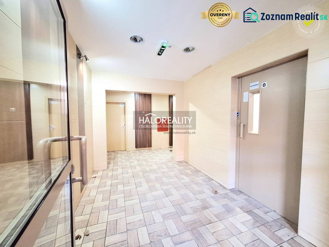 A nice entrance hall with an elevator and bright walls in a 2-room apartment.