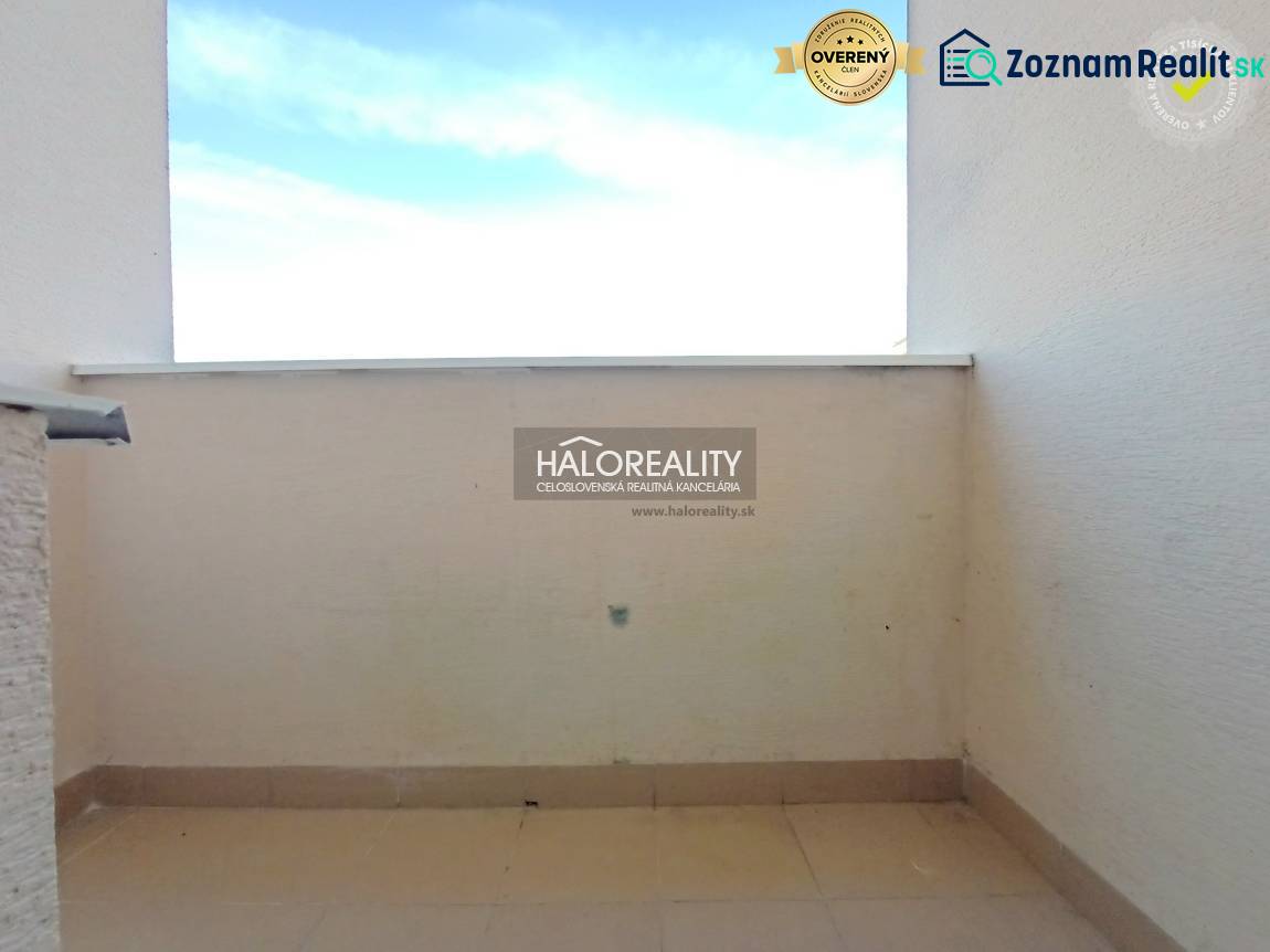 Balcony of a 3-room apartment in Handlová, view of the open space and the sky.