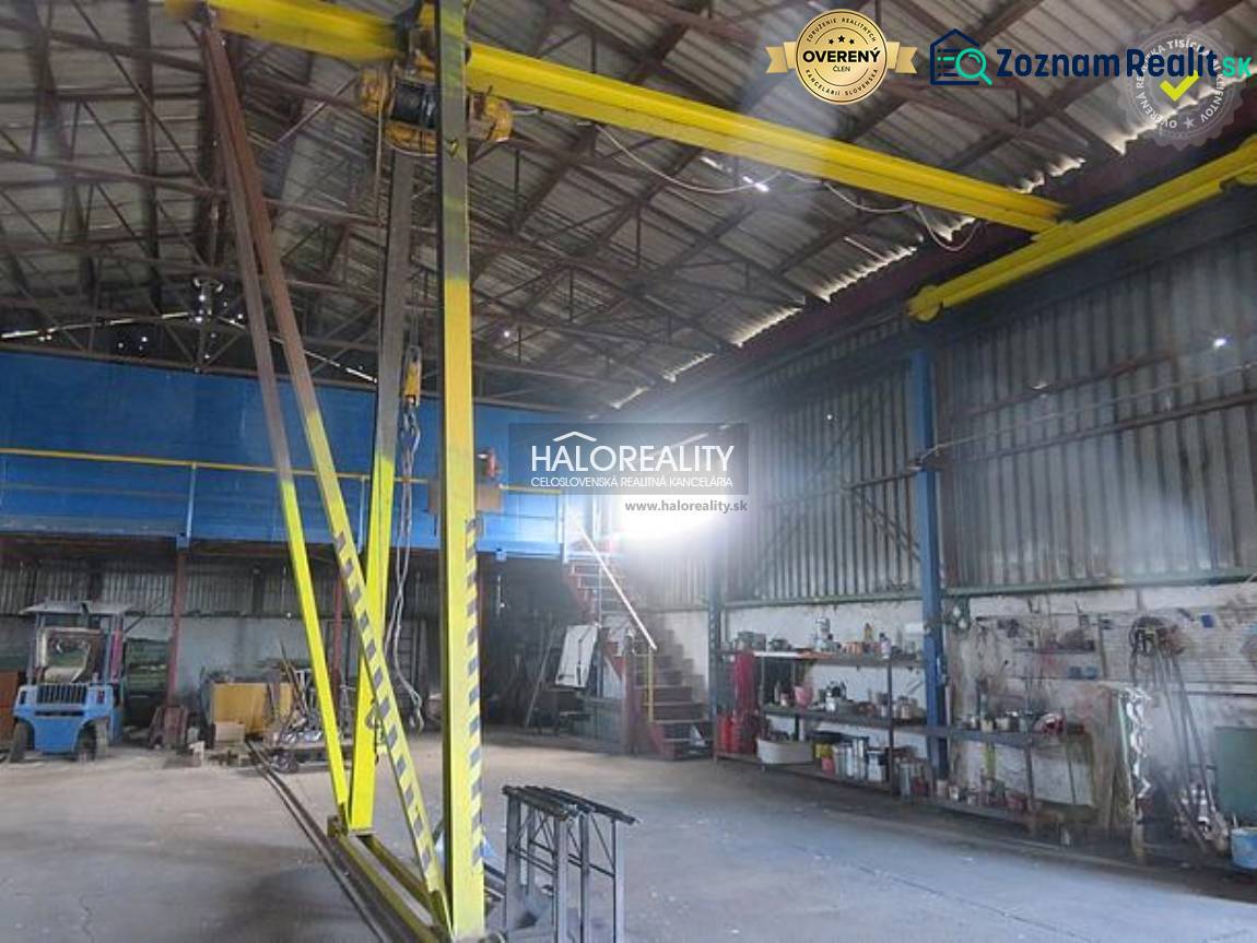 Industrial hall interior with a crane and work tools in warehouses and halls.