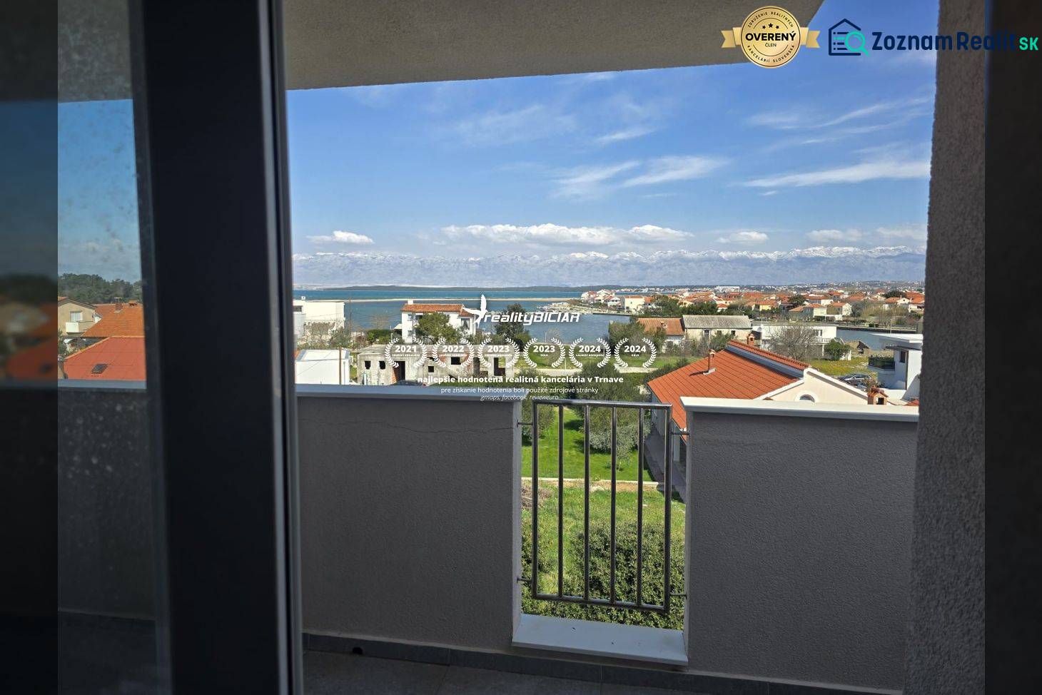 The view from a holiday apartment in Nin of the Adriatic Sea and surrounding houses.