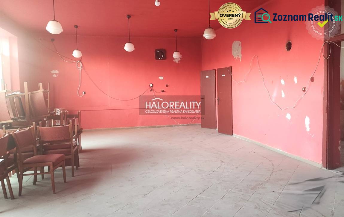 Empty, red commercial spaces with chairs and floor tiles, five light fixtures visible.