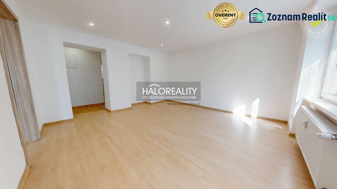 A room with a wooden floor decor in a two-room apartment. Light through a large window.