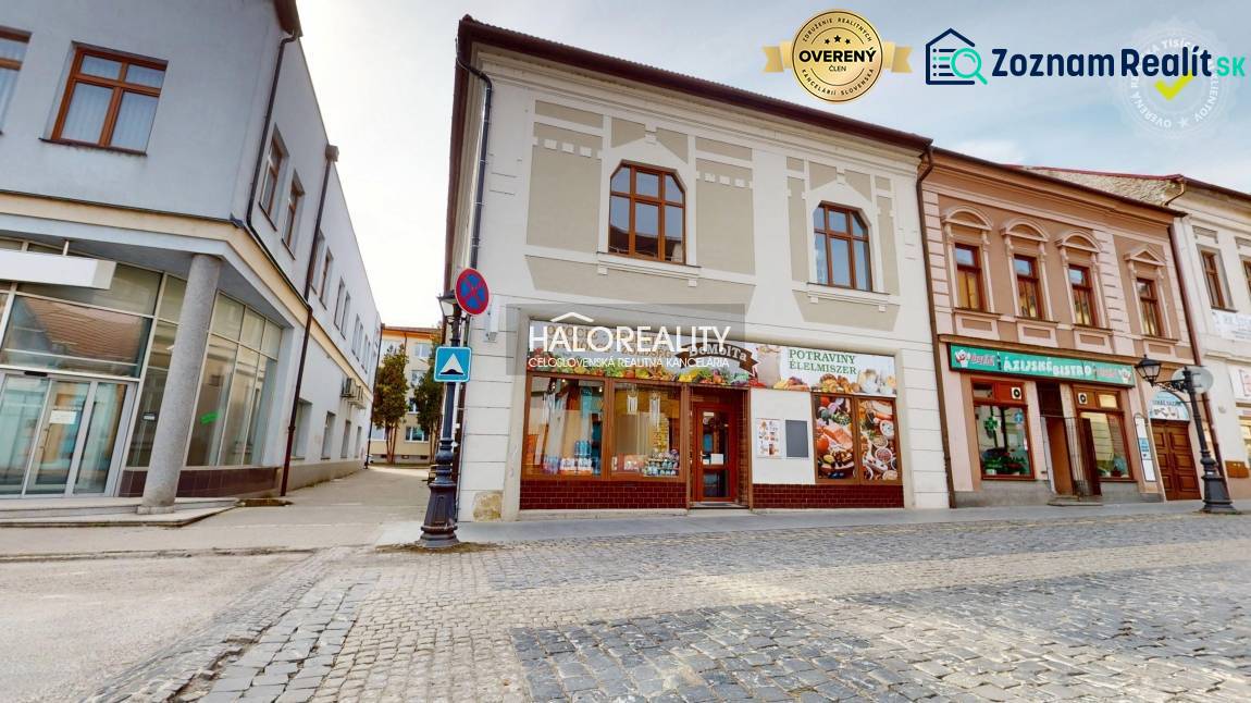 Commercial premises in Rimavská Sobota with an ancient facade and stone paving.
