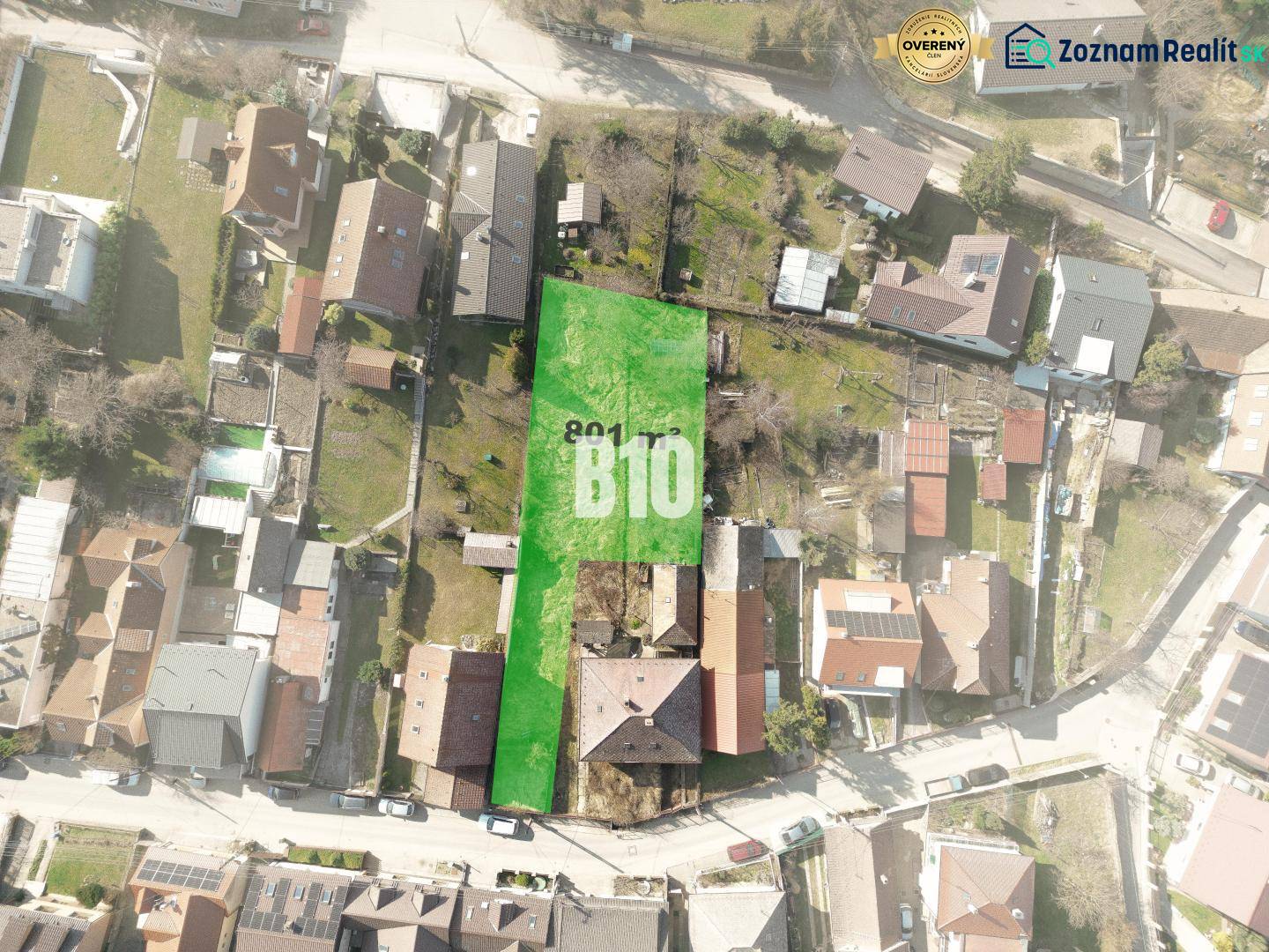 Aerial view of a plot in Marianka suitable for living, surrounded by buildings.