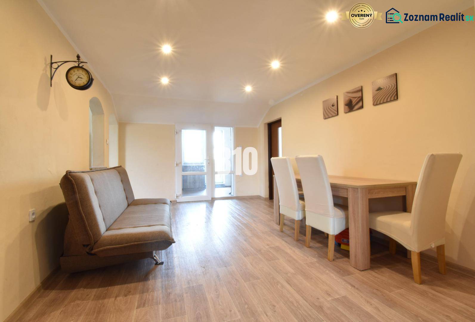 Living room in a family house with a sofa and a dining table.