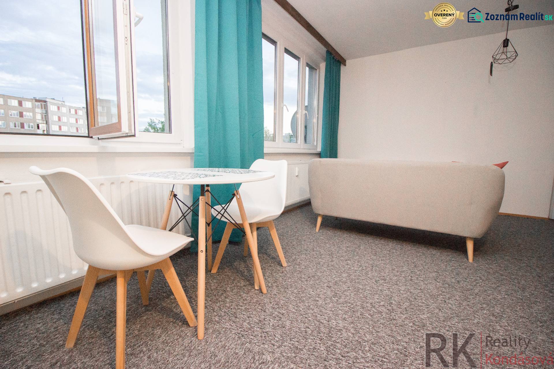 Living room with a table and chairs in a 4-room apartment, bright curtains, light carpet.