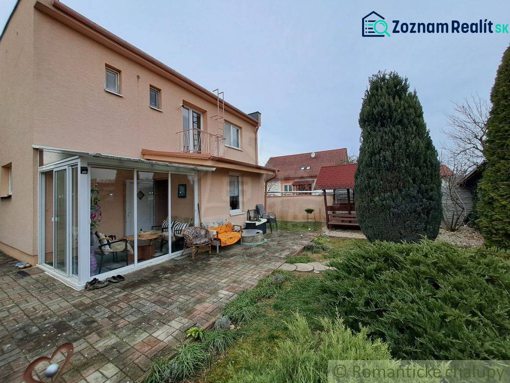 A family house in Veľké Ripňany with a terrace, a winter garden, and a well-maintained garden.