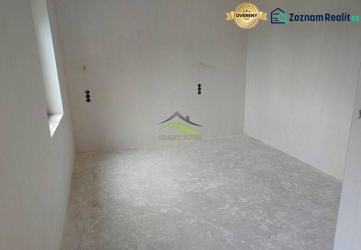 Empty room with a concrete floor in a family house.