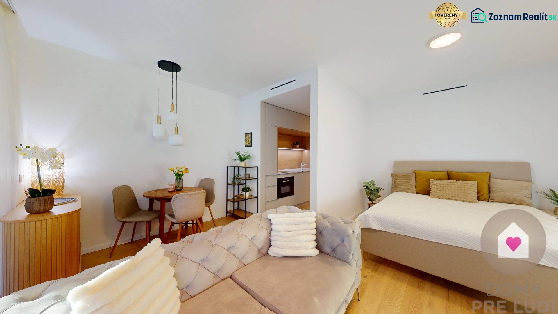1-bedroom apartment with a sofa, dining table, kitchen, and bed, floor with wooden decor.
