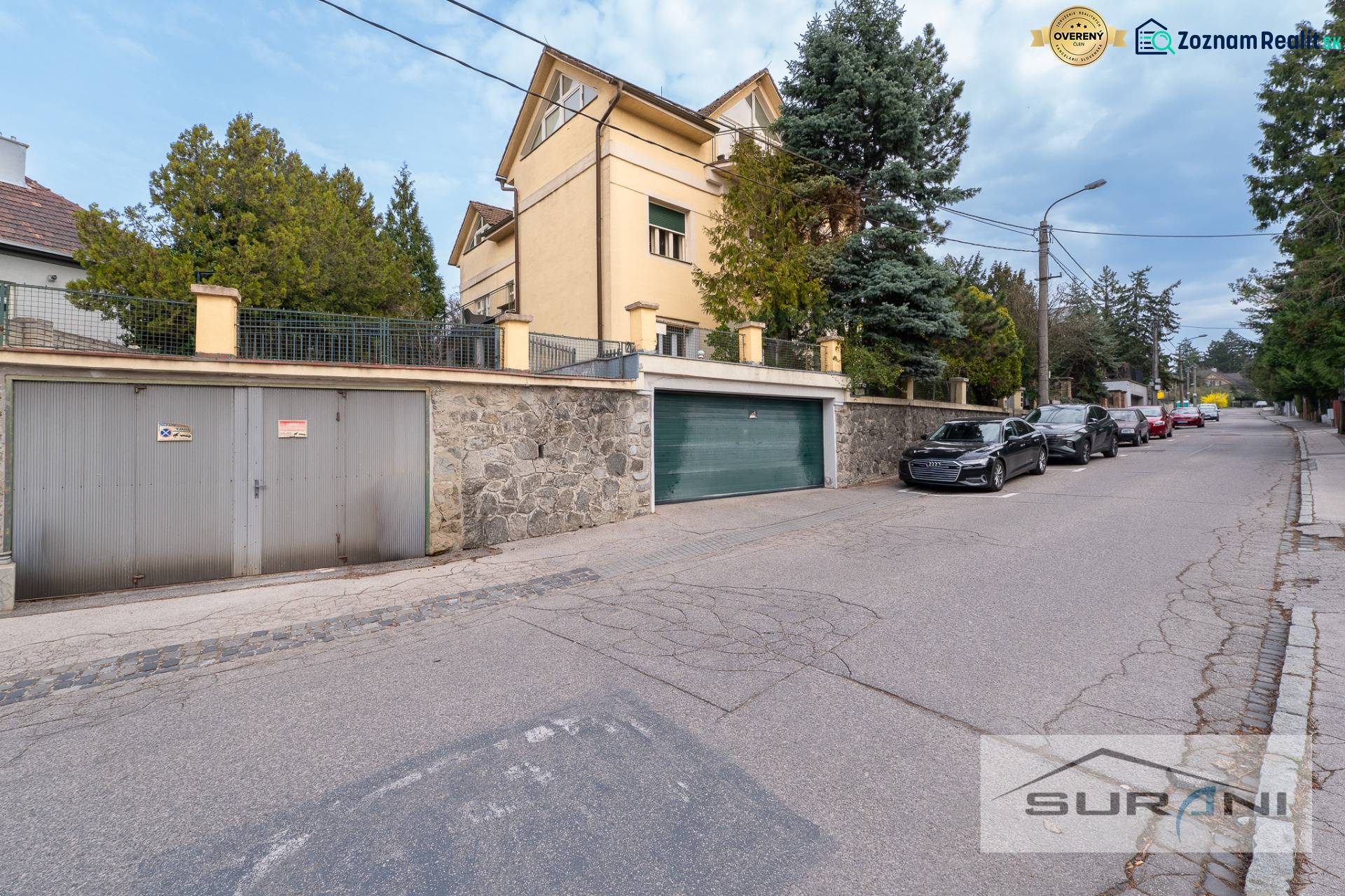 Krčméryho Street in Bratislava - Staré Mesto with a garage entrance and parked cars.