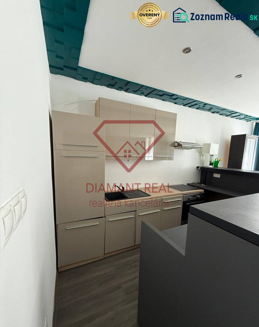 A kitchen with built-in cabinets and a cooktop in a family house.