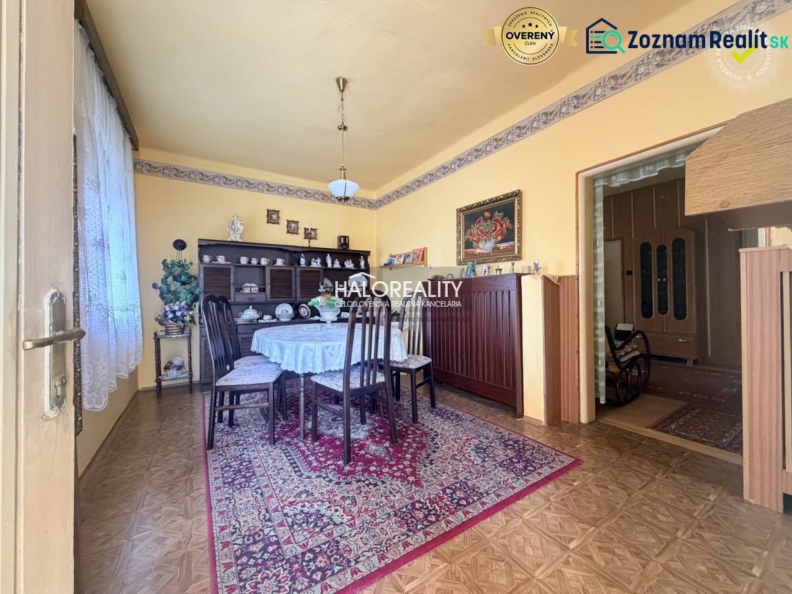 A gently tuned dining room in a family house with a wooden decor floor.