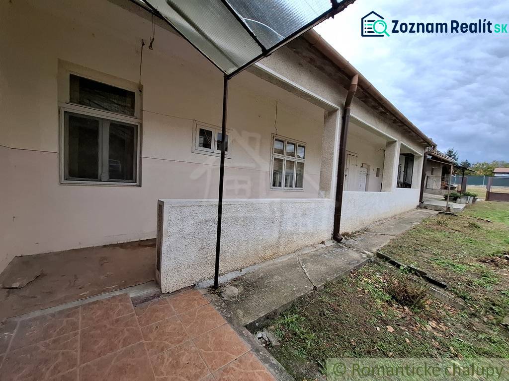 A family house in Mužla with a small yard and a covered terrace.