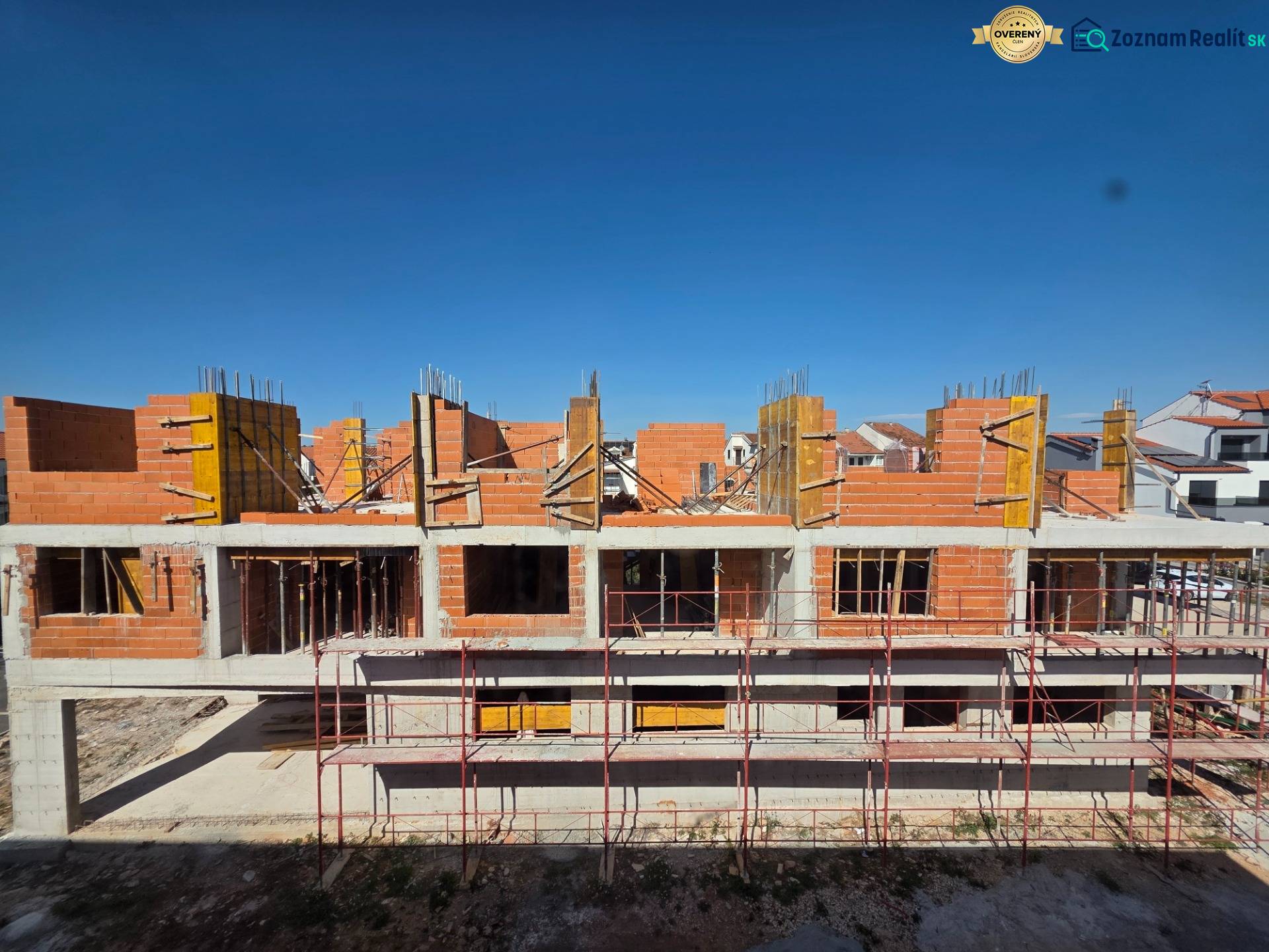 An unfinished 3-room apartment in Srima with red bricks and scaffolding.