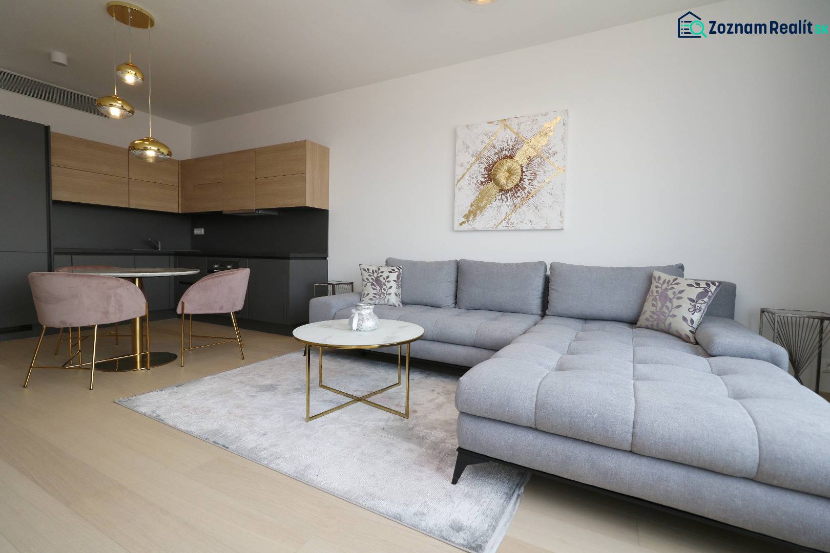 Stylish living room with a sofa and kitchen in a two-room apartment.