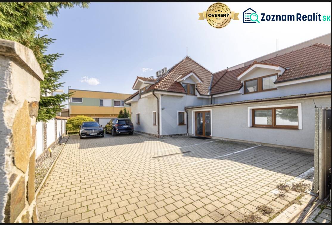 A family house on Podpriehradná Street in Bratislava-Vrakuňa with a spacious paved parking area.