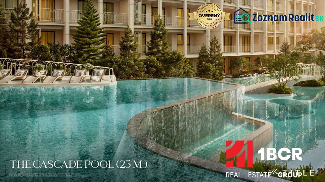 A pool with cascades during the construction of apartments in Phuket with loungers and greenery.