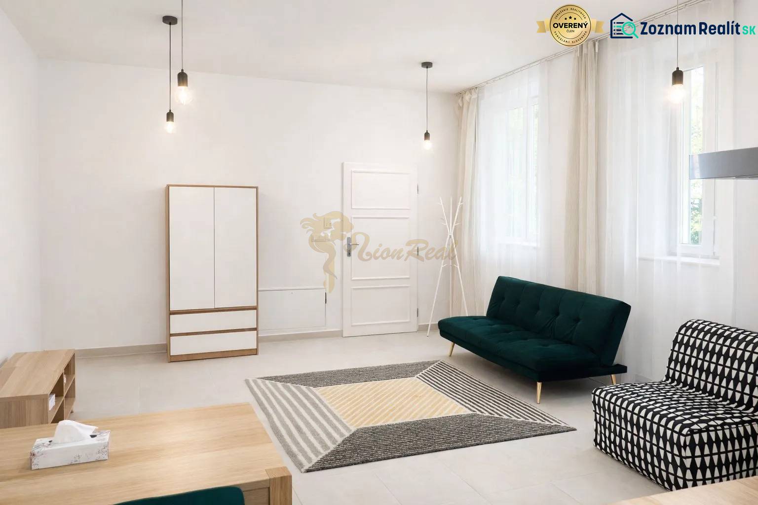 Living room in a two-room apartment with sofas, a cabinet, and a wooden decor floor.