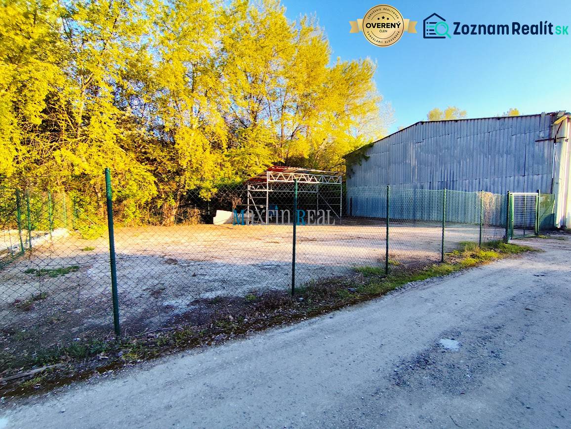 Lands - commercial in Nitra, fenced area with surroundings covered by trees.