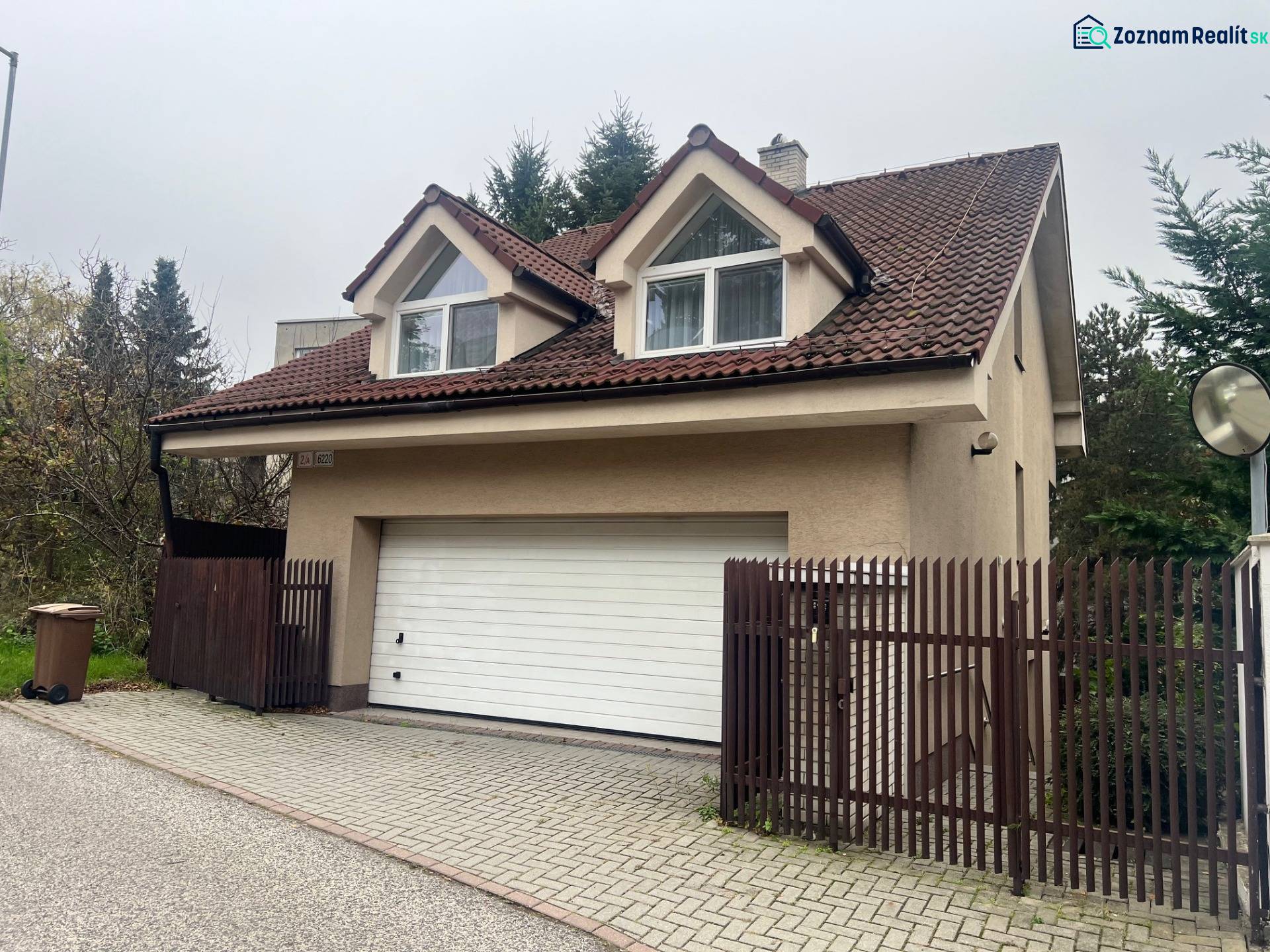 A family house on Mozartova Street in Bratislava - Staré Mesto with a garage and a pitched roof.