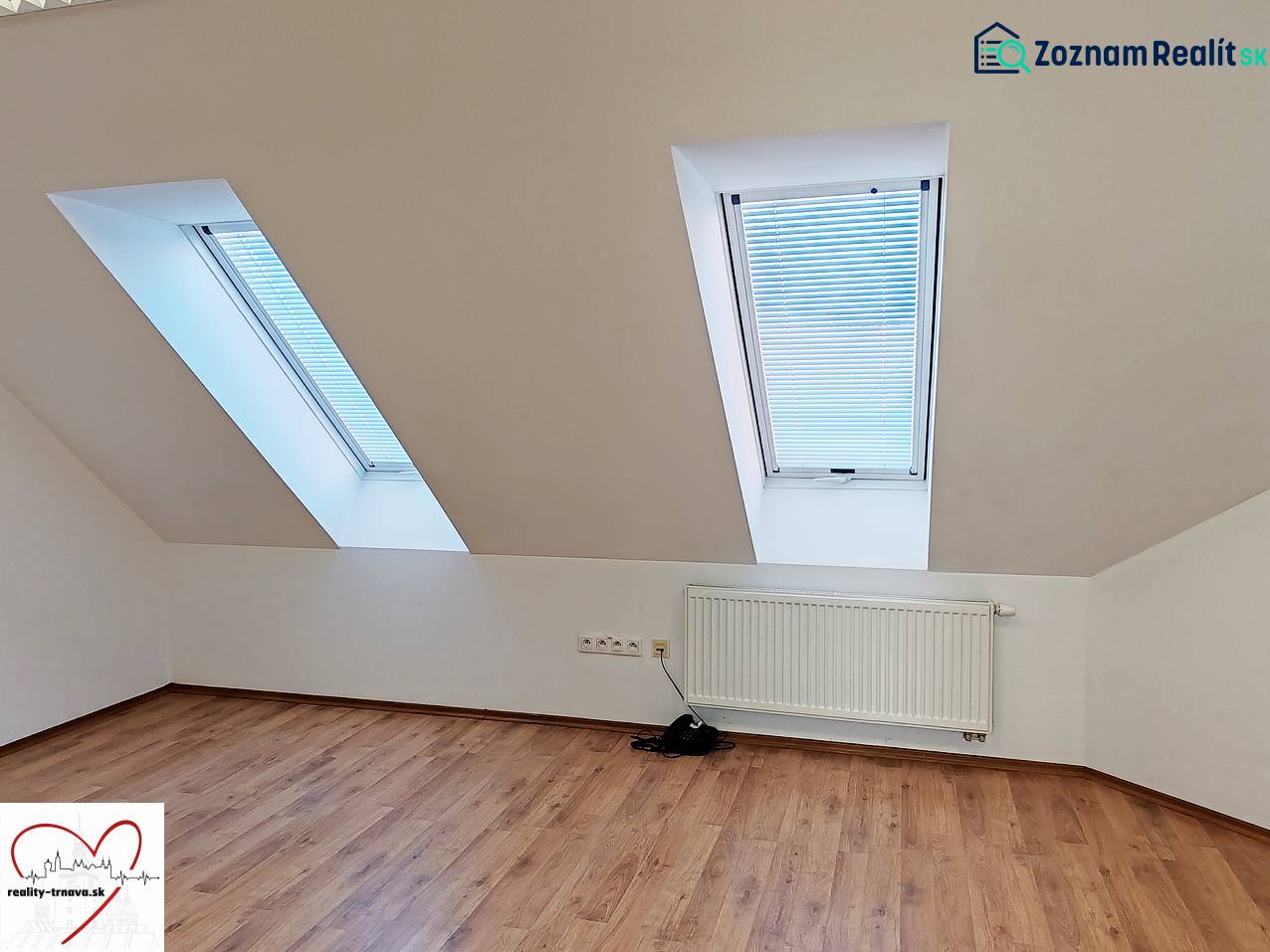 Offices with skylights and wooden decor flooring.