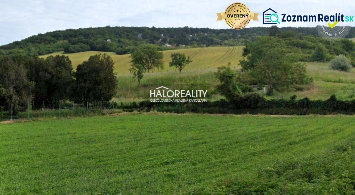 Fertile fields and hills near Hlohovec, surrounded by greenery in gardens and forests.