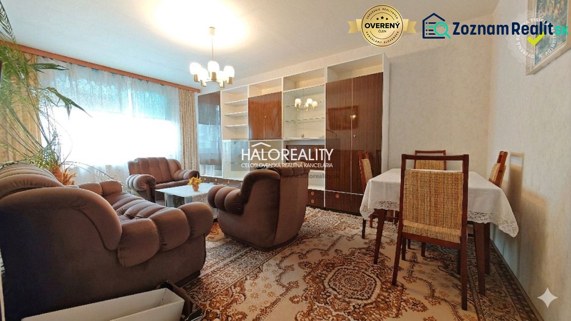 Living room with a comfortable sofa and a dining table in a 4-room apartment.