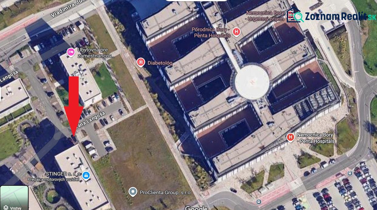 Aerial view of the Lamač area in Bratislava with a healthcare facility and parking lots.