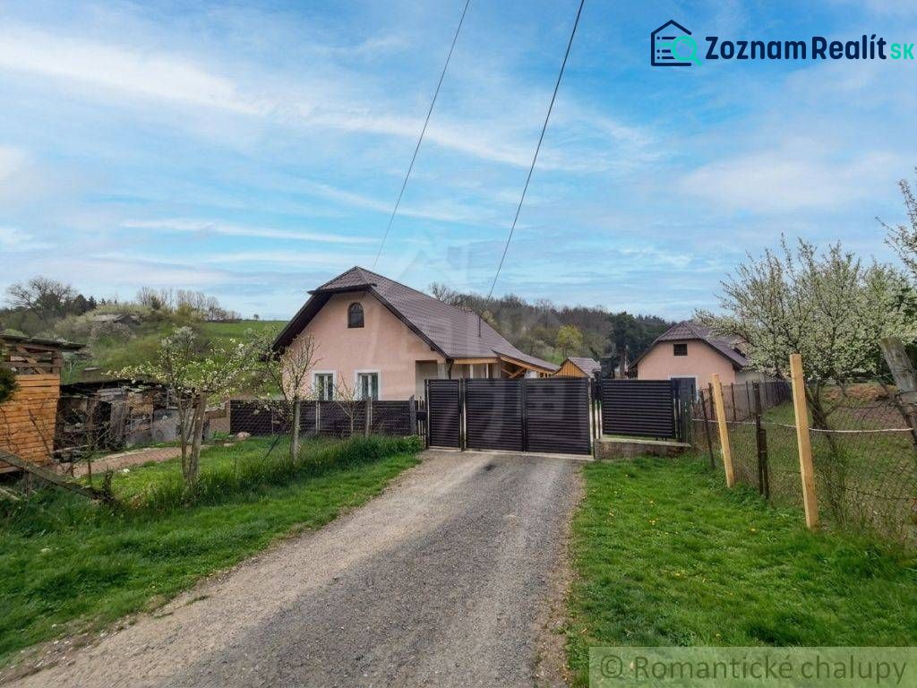A family house in Dolná Strehová with two floors and a fence.