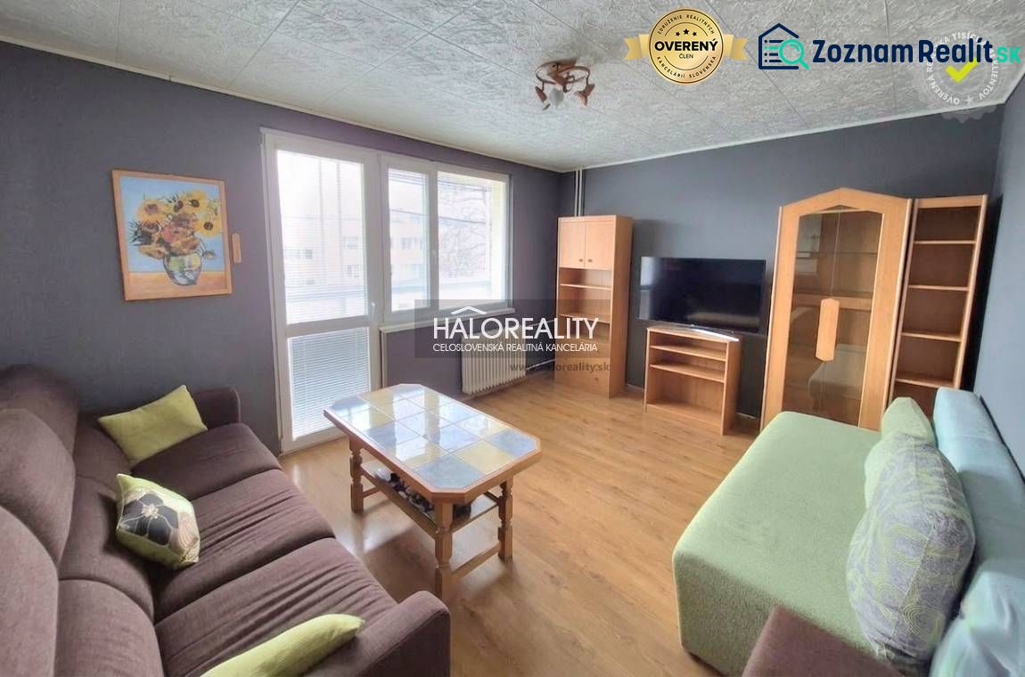 Living room with sofas, a coffee table, and a TV in a three-room apartment.