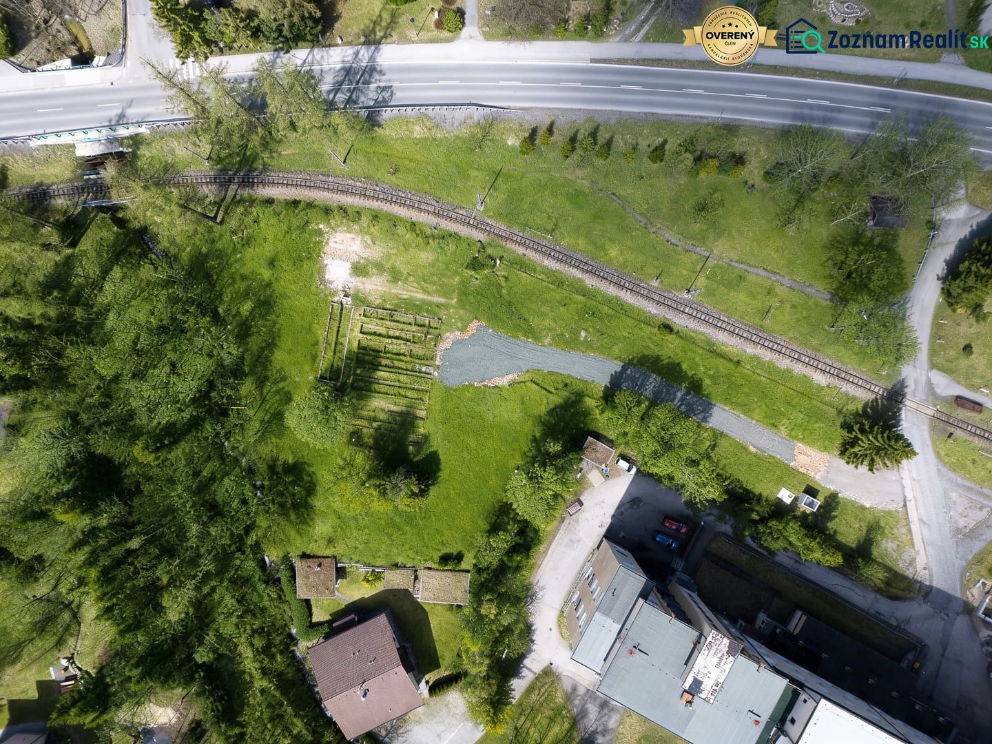 Aerial view of the railway track and surroundings near hotels and guesthouses in the High Tatras.