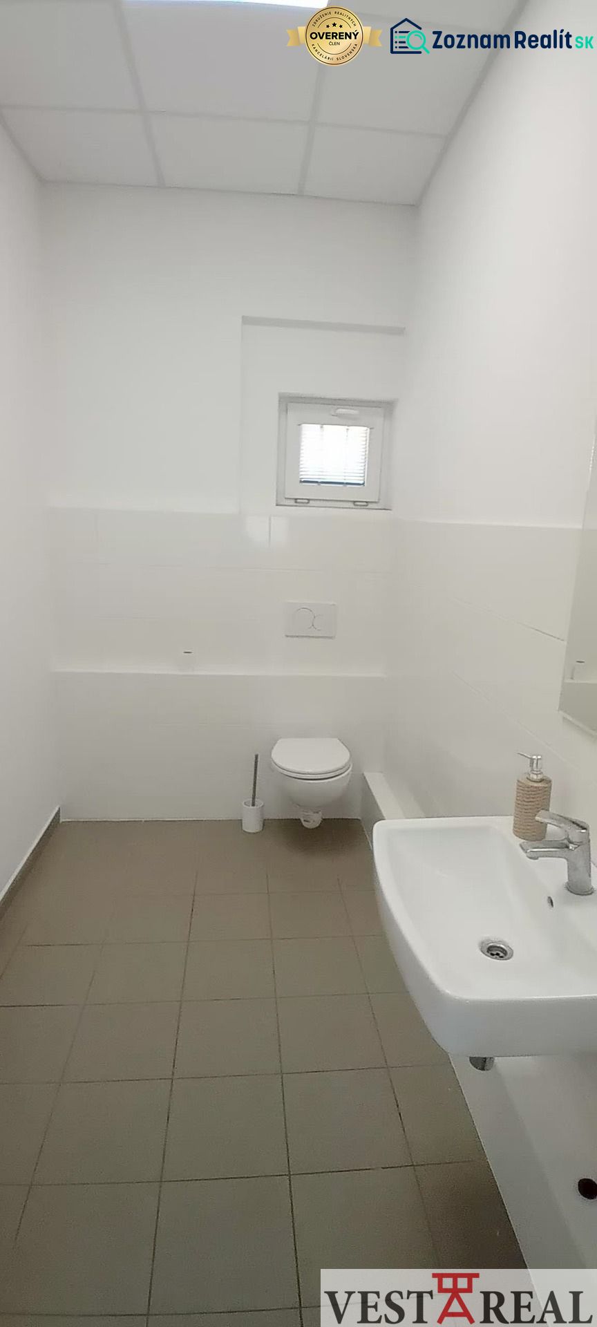 White toilets with a sink and a small window, Warehouses and halls.