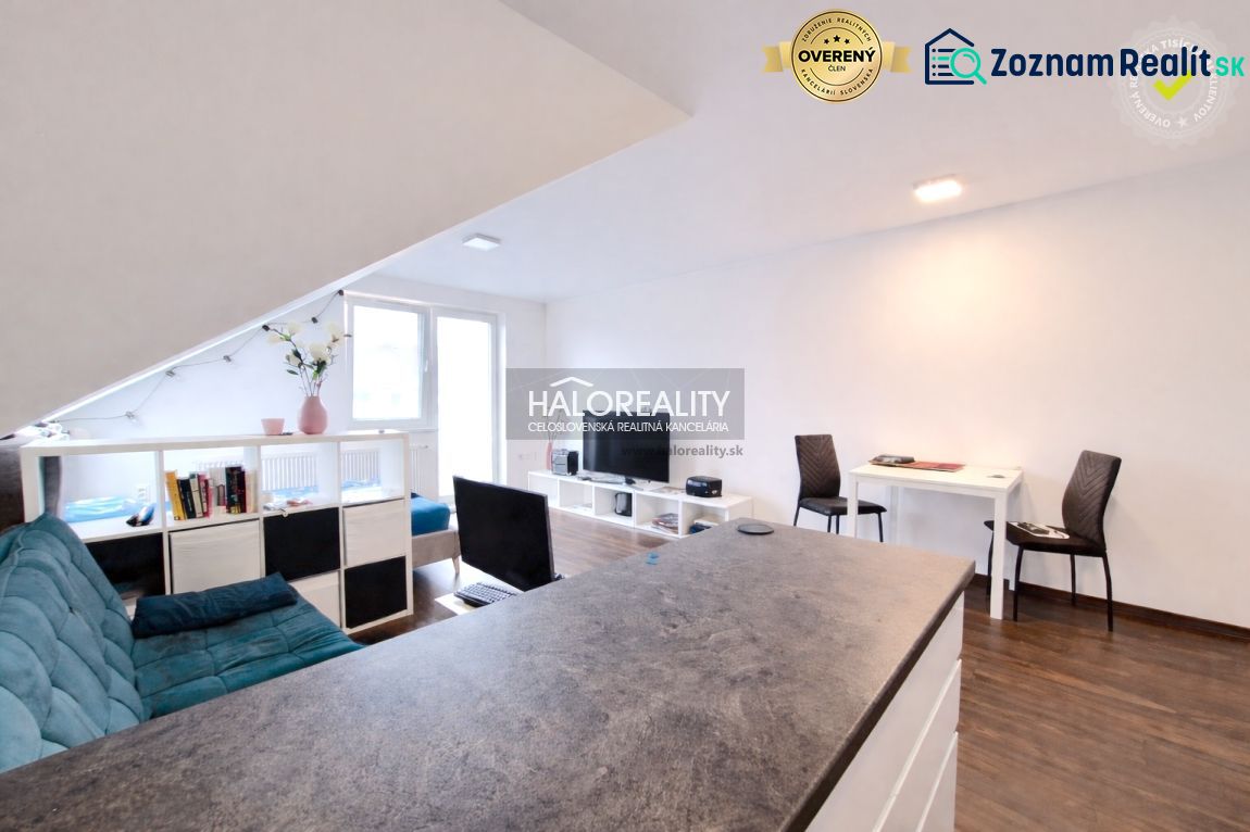 Living space in a 2-room apartment with a wooden decor floor and light decoration.