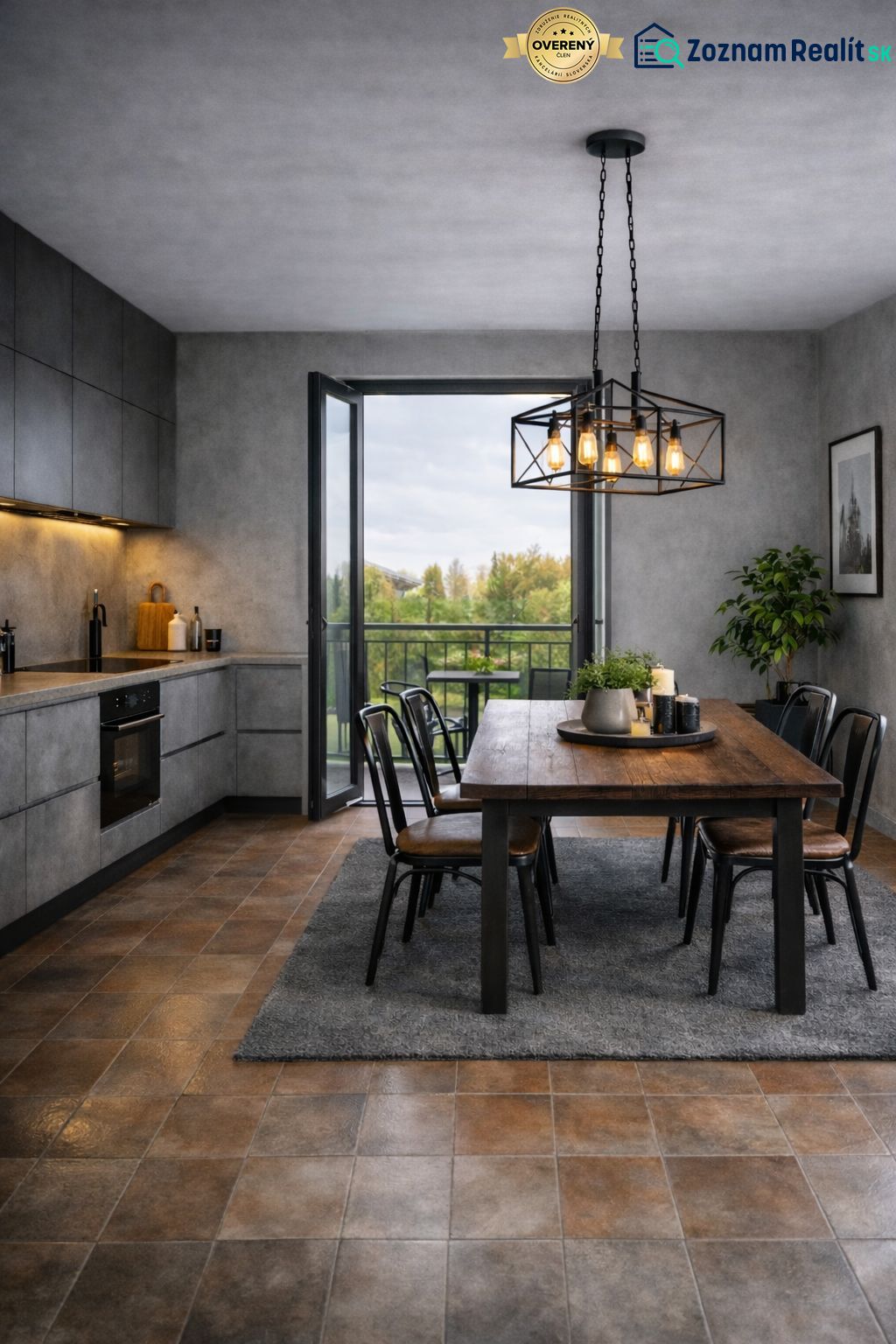 A kitchen in a 2-room apartment with a dining table and a view of the balcony.