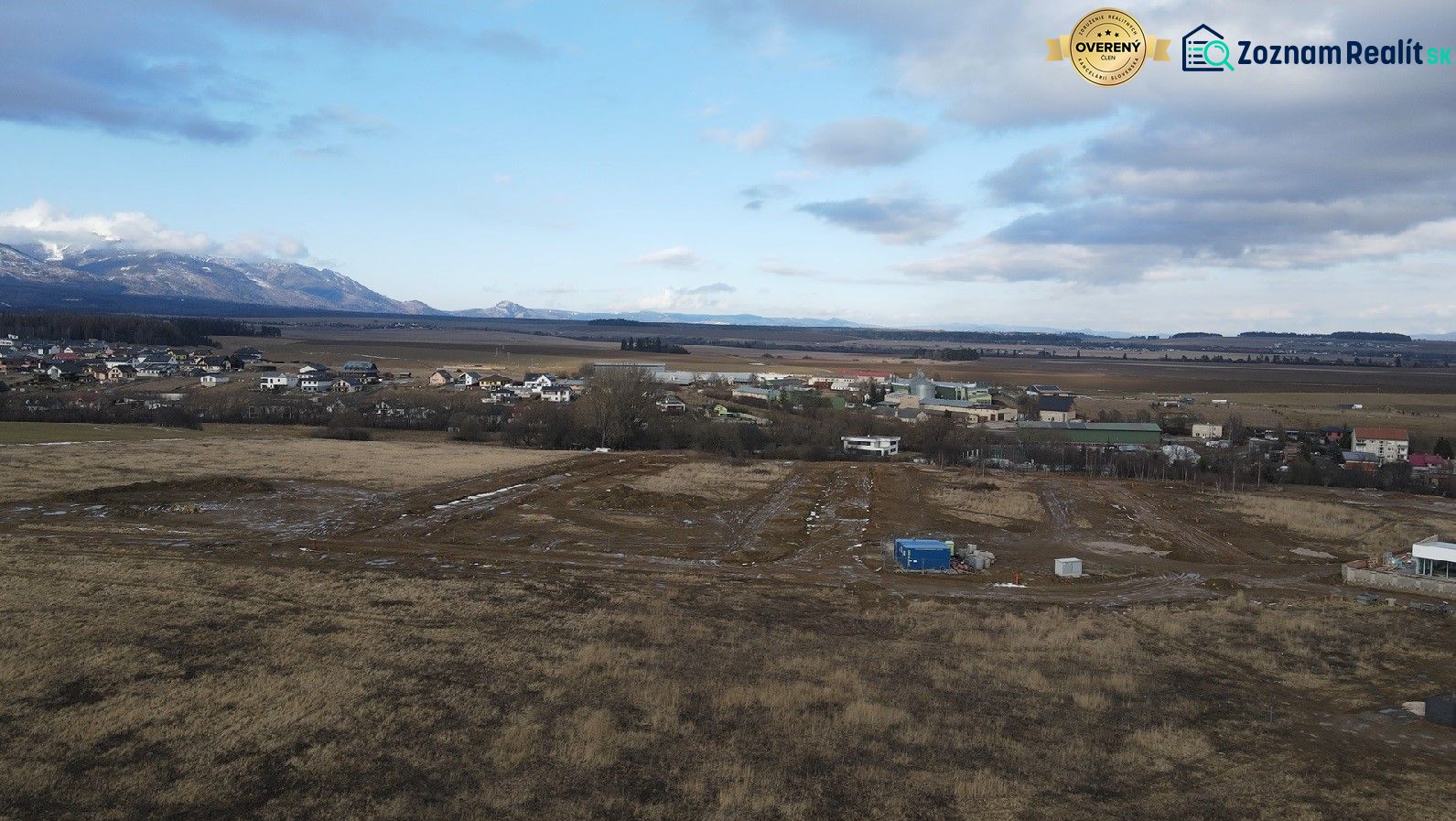 Panorama of development plots in Mlynica, with views of the mountains and rural landscape.