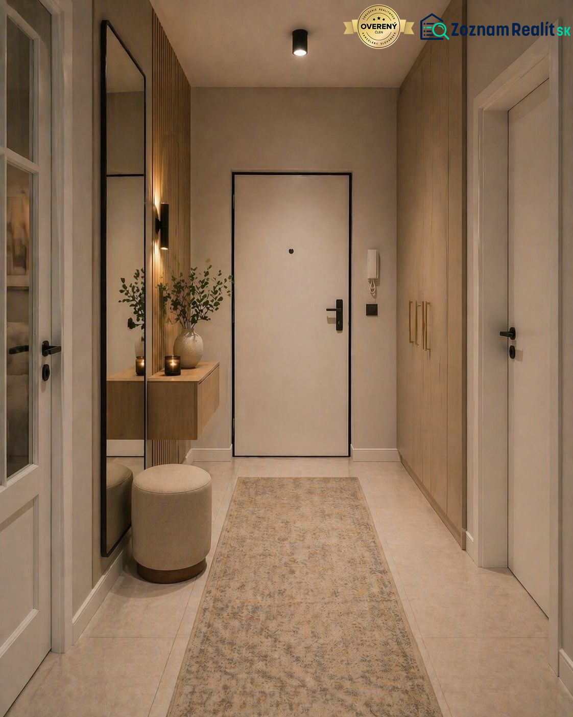 A hallway of a 2-room apartment with modern furniture, a mirror, and decorative elements.