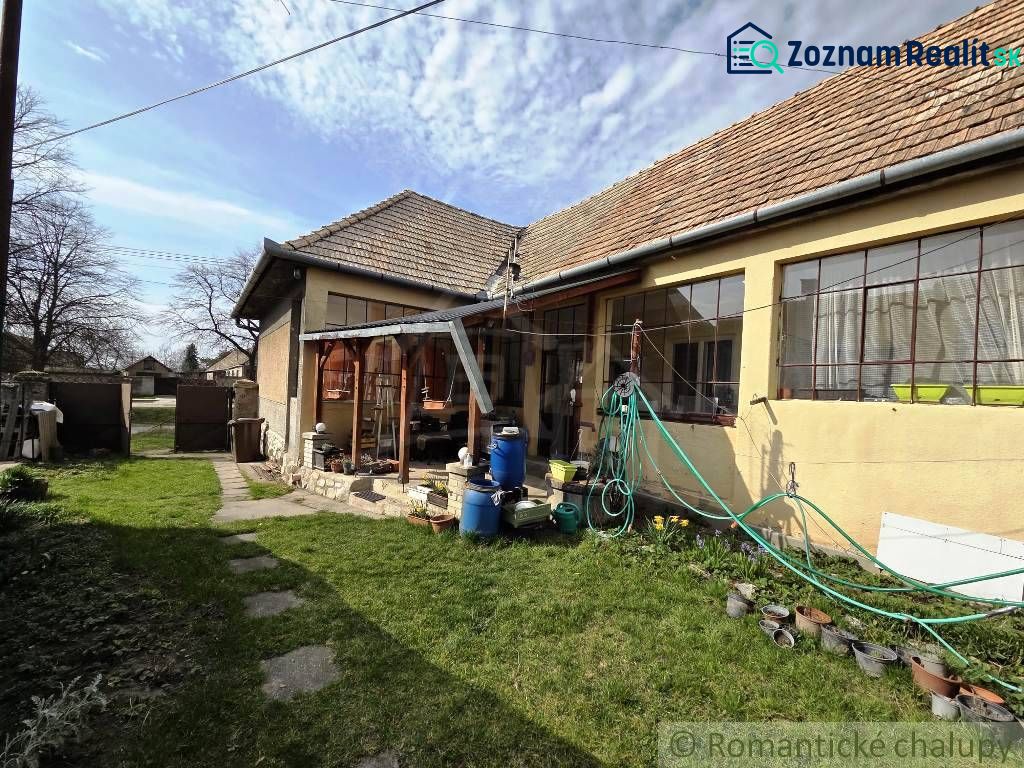 A family house in Šahy with a lawn and an extension in the garden.
