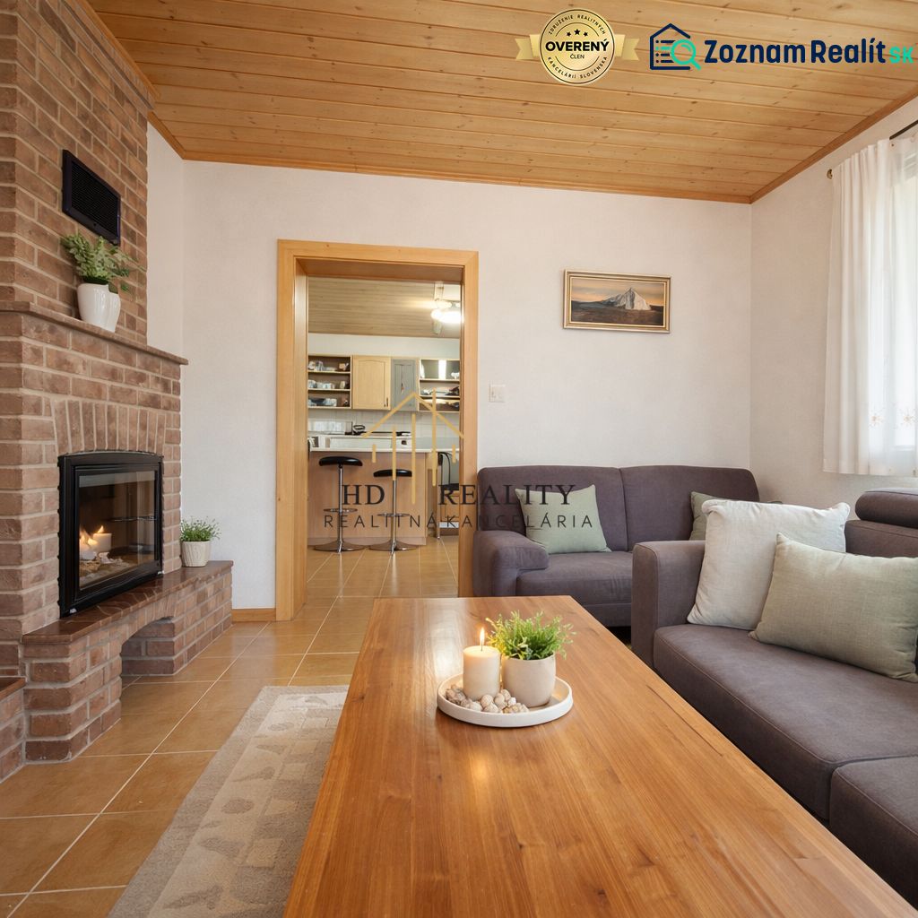 Living room in a family house with a fireplace, sofa, and wooden floor decor.