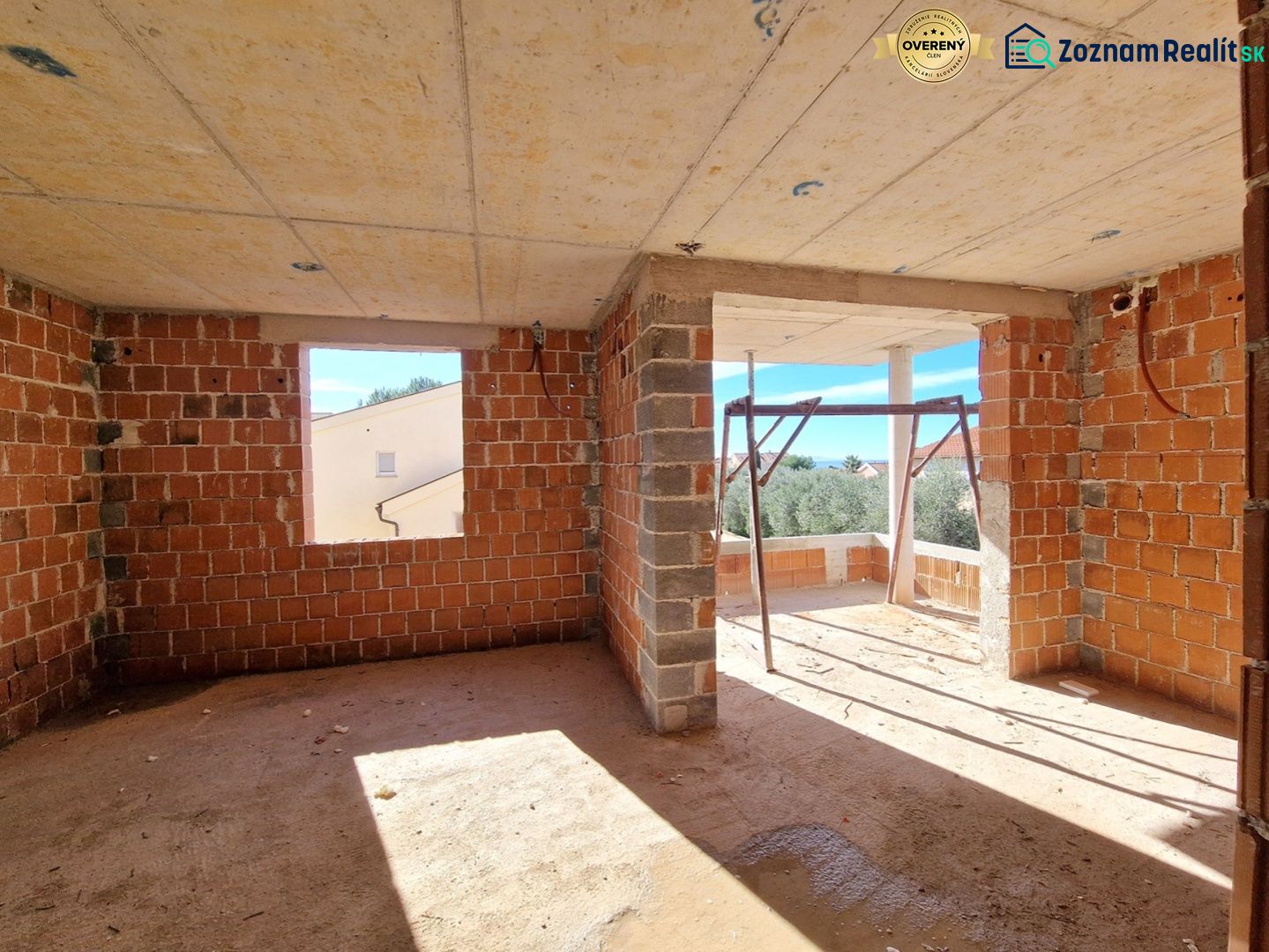 Unfinished room with open walls in a 3-room apartment without flooring with wooden decor.
