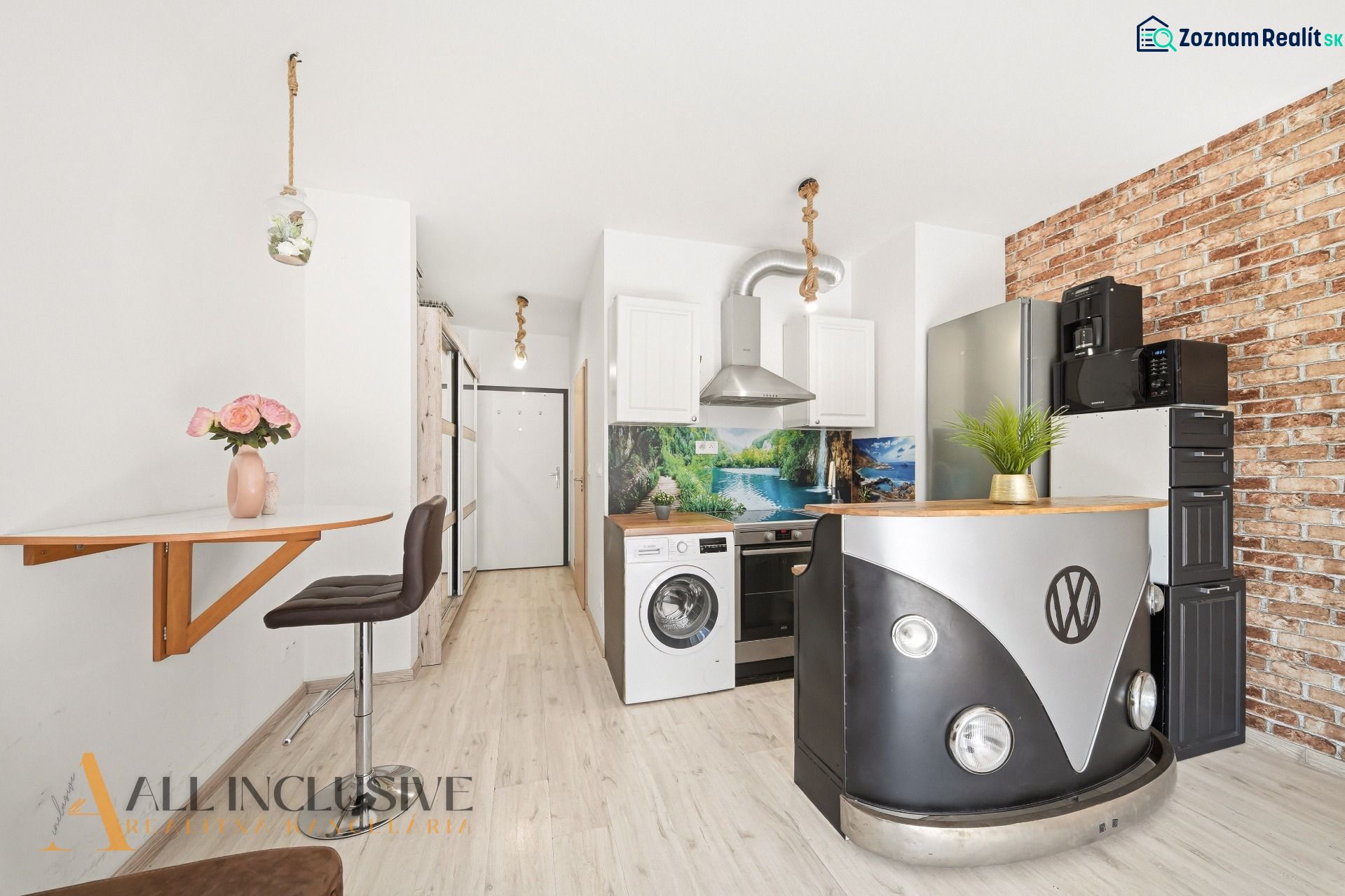 A kitchen with an original VW table and a floor with a wooden decor in a 2-room apartment.