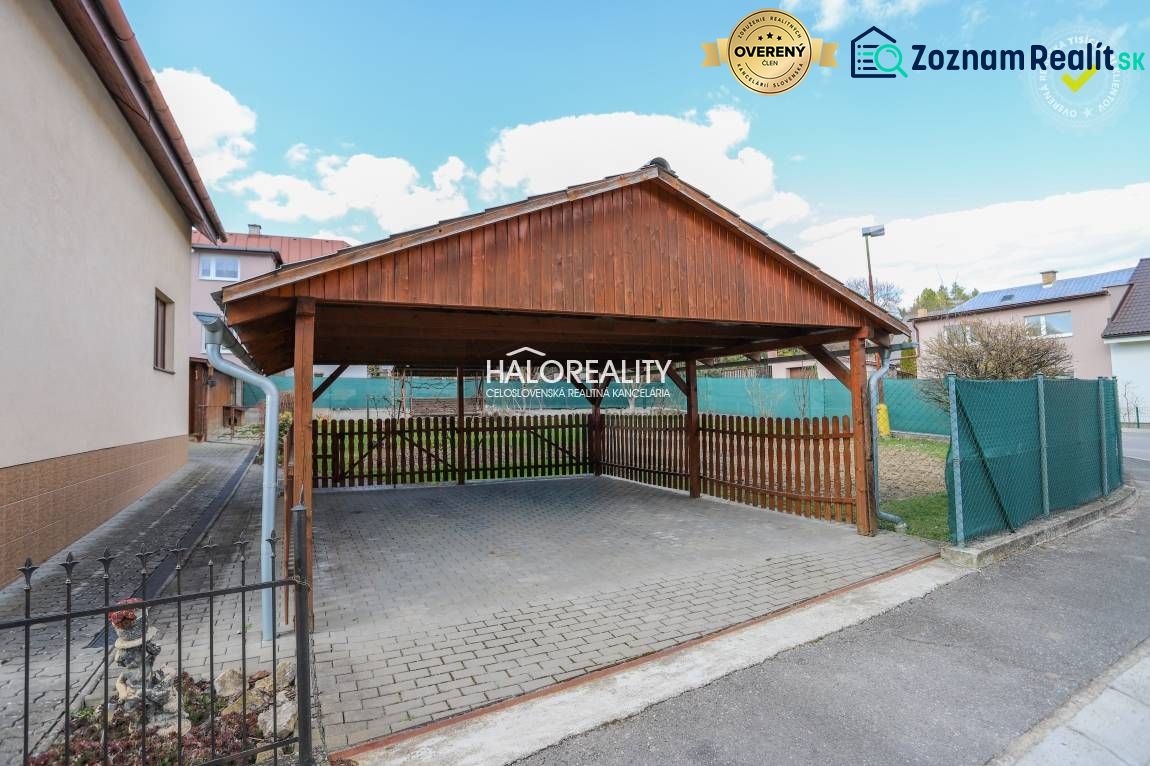 Carport at a family house in Považská Bystrica with a wooden structure and paving.