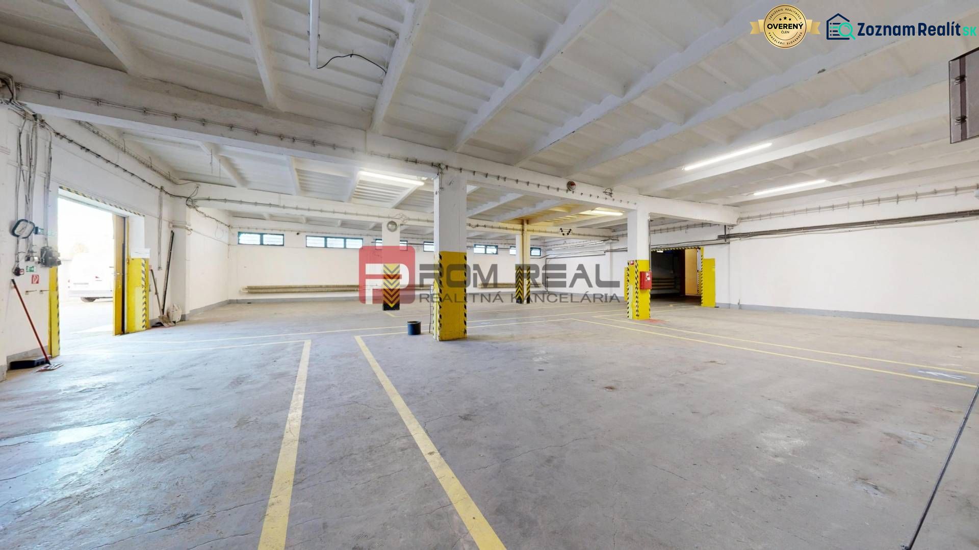 A spacious hall with load-bearing columns and significant lighting, suitable for warehouses and halls.